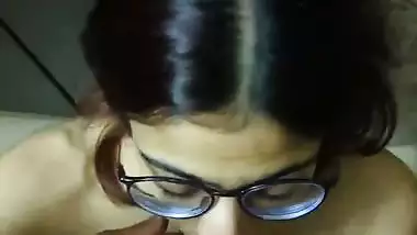 Indian bikini girl in glasses gives blowjob to boyfriend