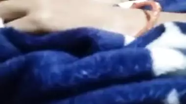 Slutty Desi girl with big XXX melons poses from under the blanket