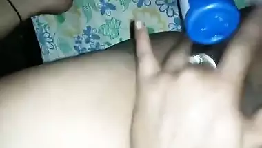 Hot Desi female shows off her smooth XXX pussy shoving a sex toy inside