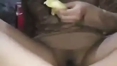 Indian girl masturbates using a banana and eats it